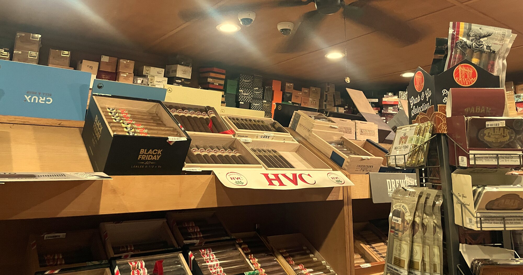 Shelves of open cigar boxes lining the walk-in humidor at Havana
